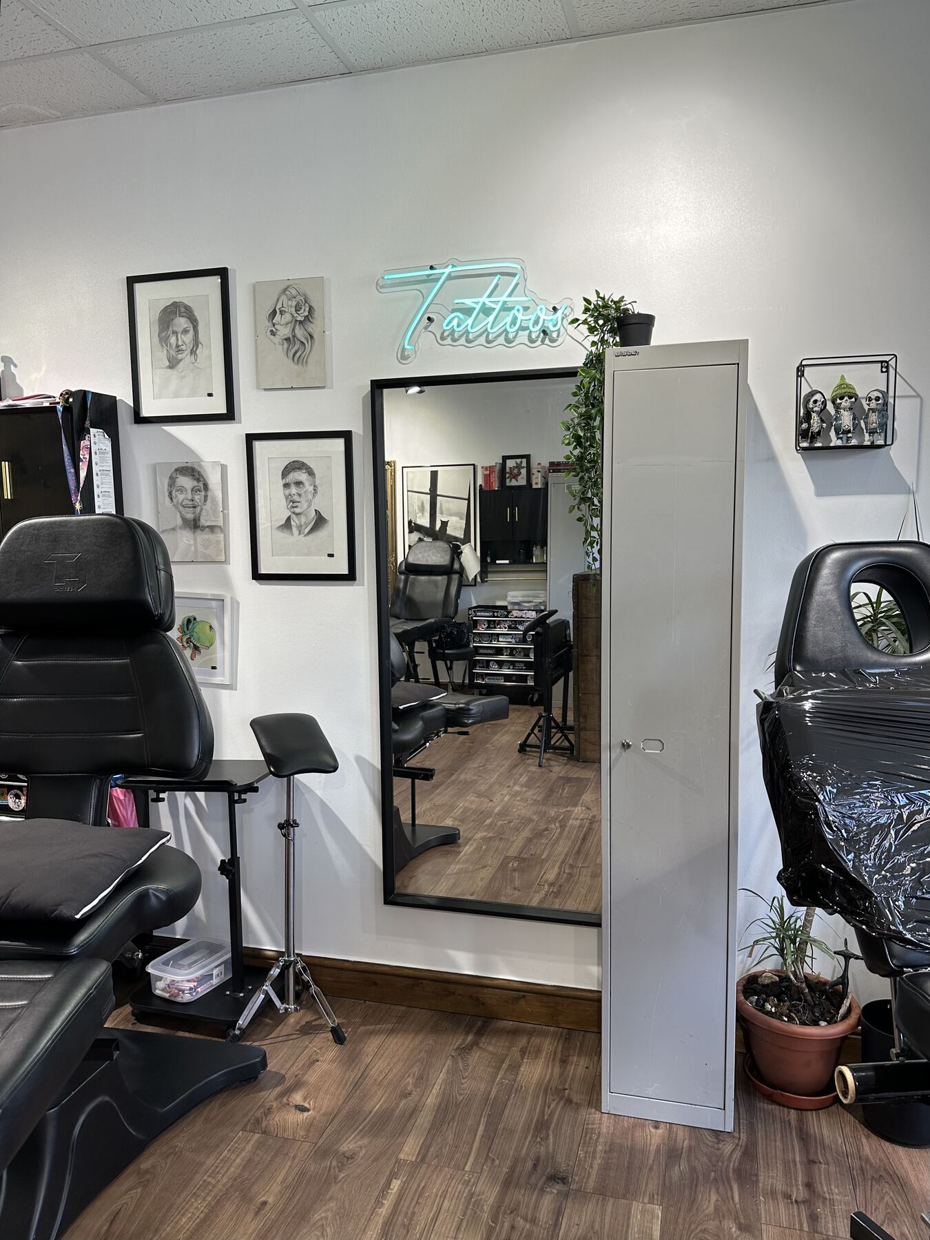 Tattoo station with neon sign at S-Line Studios, Swindon